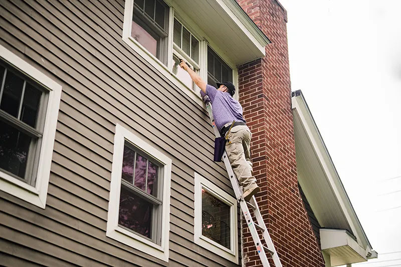 Window Genie tech performing residential window cleaning services.