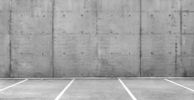 Empty parking lots in an open parking garage.