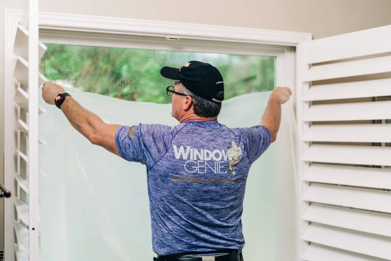 Window Genie tech performing residential window tinting, Roseville, CA.