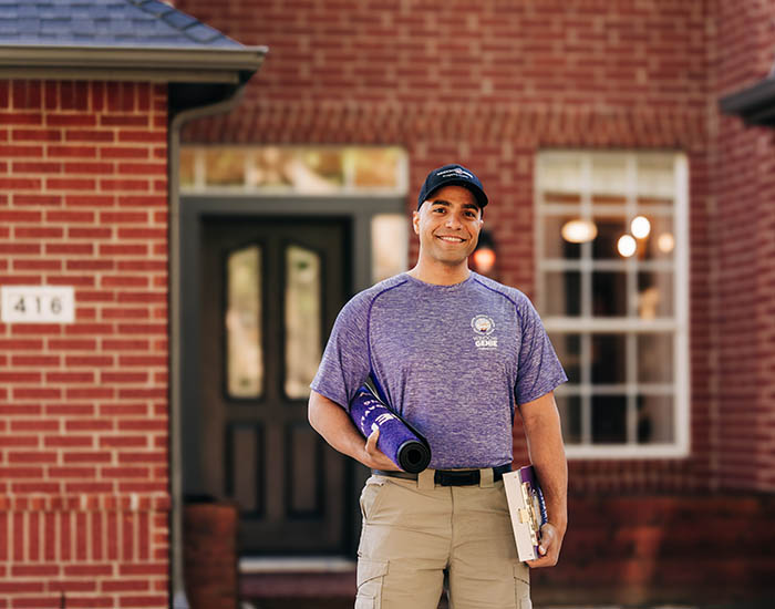 Window Genie tech outside a customer's home before a window cleaning appointment. 