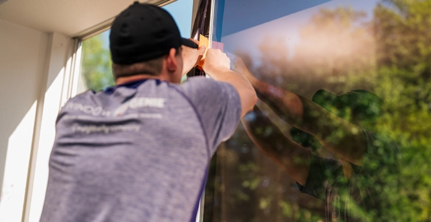 Window Genie professional installing solar control window film.