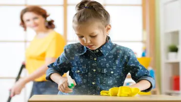 girl cleaning counter